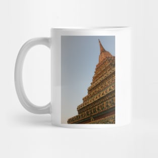 First unusual low angle view of a Buddha stupa against clear sky. Mug